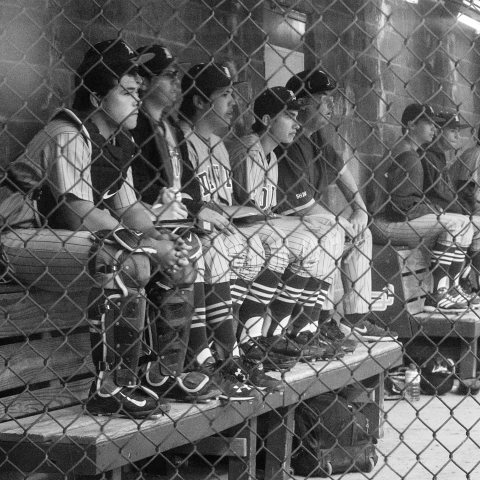 boy in dugout with dan