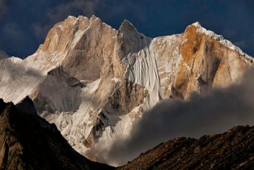 This is a view of Mount Meru as seen from Tapovon Basecamp. The Shark's Fin is the central pillar in the formation and the part of the mountain most obviously shaped like a shark's fin.